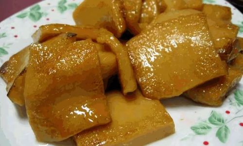 The Art of Crafting Traditional Sugar-Fried Yellow Rice Cakes:A Spring Festival Delicacy
