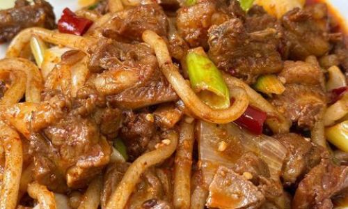 The Sizzling Symphony of Stir-Fried Lamb:A Deep Dive into China’s Explosive Culinary Tradition