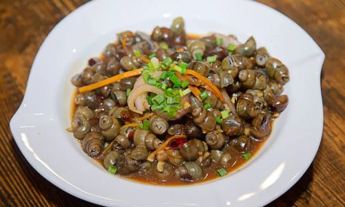 Stir-Fried River Snails:A Flavorful Journey Through China’s Culinary Soul