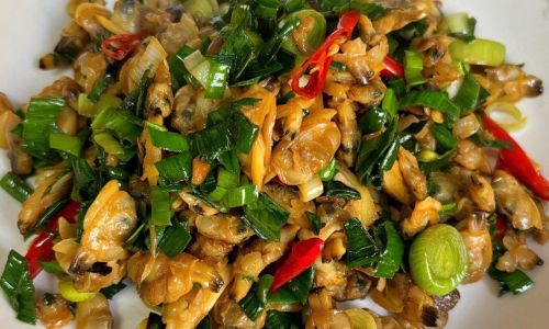 Mastering the Art of Stir-Fried Clam Meat:A Flavorful Journey from Kitchen to Table