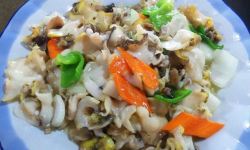 Stir-Fried Conch:A Symphony of Sea,Spice,and Skill